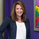 Marie Unger, CEO of Emergenetics, headshot against a purple background
