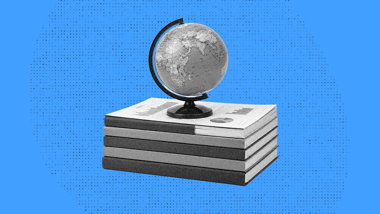 globe on a stack of books for global payroll reporting
