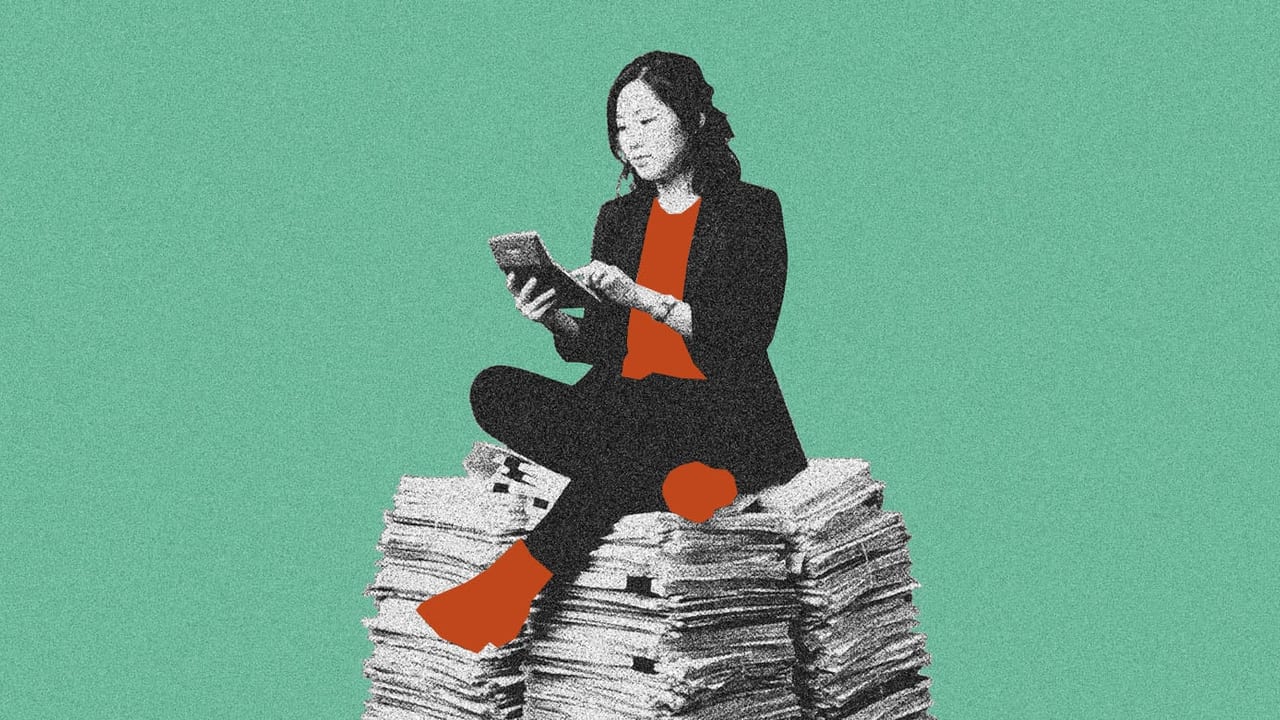 HR manager sitting on a stack of paper with a calculator for employer of record tax implications