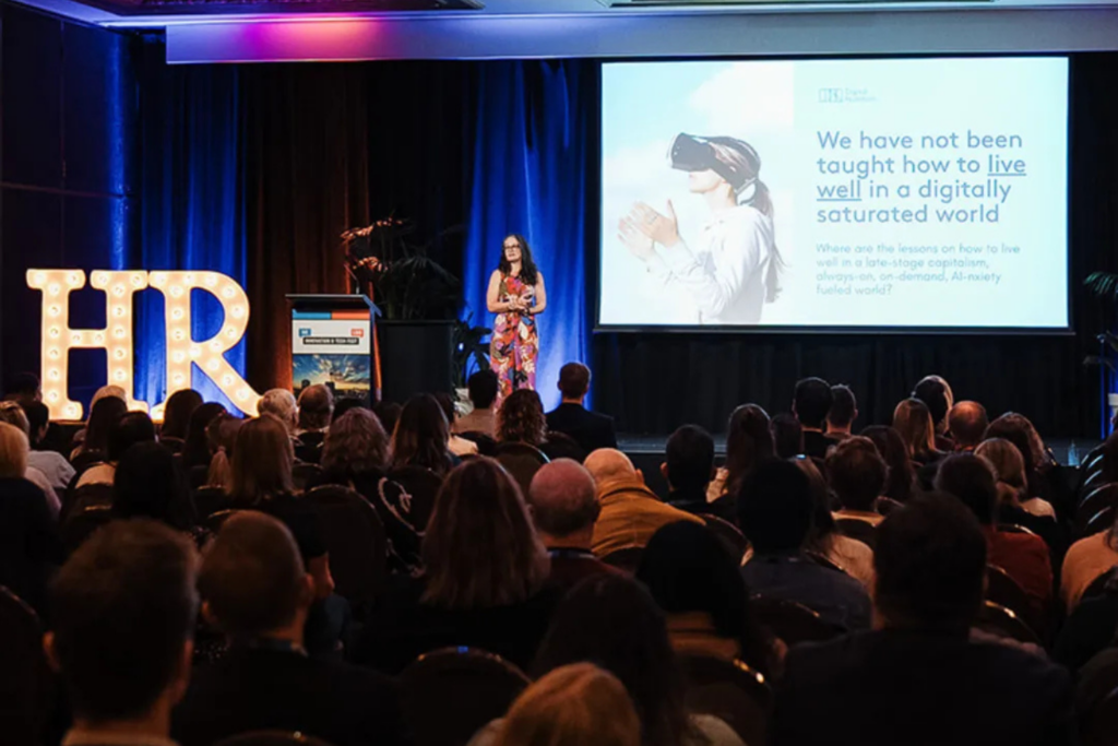 A speaker during a keynote presentation at the HR + L&D Innovation & Tech Fest New Zealand