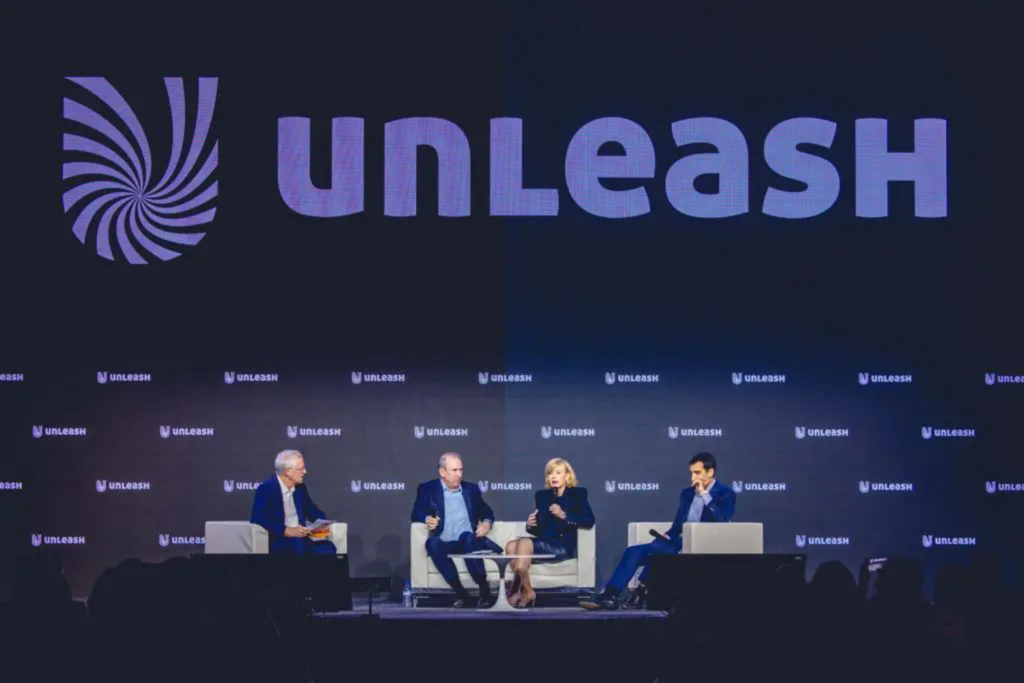 A panel discussion on stage at the UNLEASH World Conference