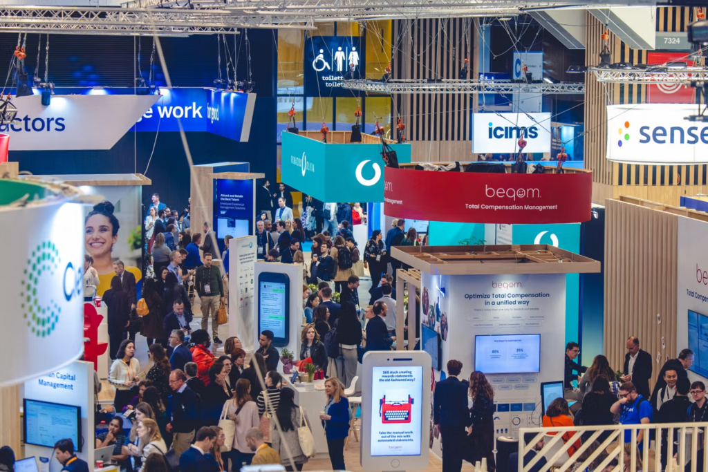 Crowded exhibition floor with HR technology vendors at UNLEASH Paris