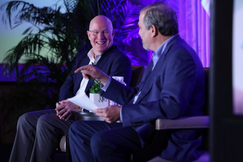 An engaging conversation between two speakers at the Annual CHRO Summit.