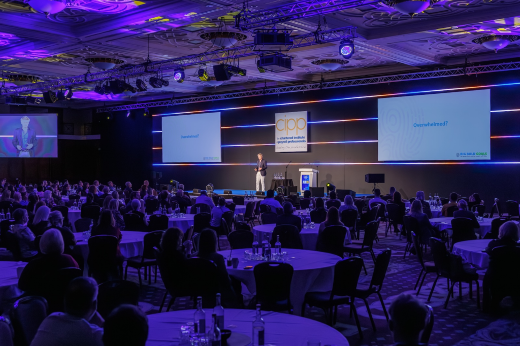 A speaker sharing insights during a keynote session at The CIPP's Annual Conference and Exhibition (ACE)