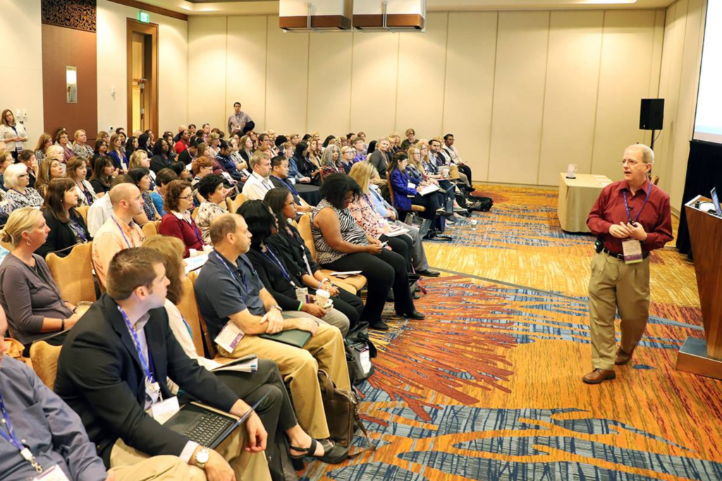 A speaker sharing insights during a keynote session at the CUPA-HR Conference