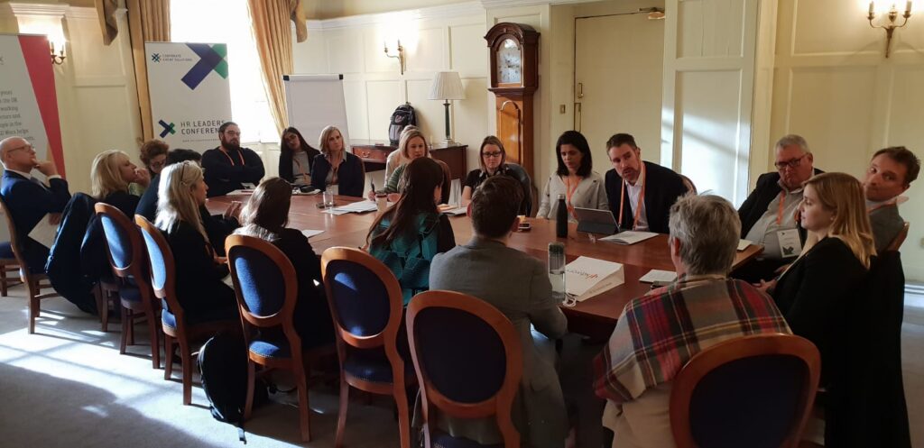 HR leaders sharing insights during a roundtable discussion at the HR Leaders Annual Conference