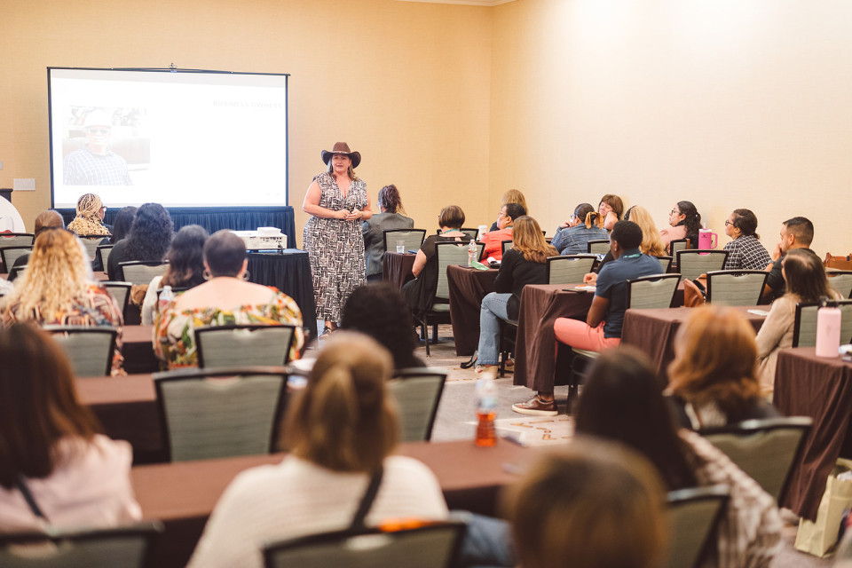 A speaker presenting in front for The Texas Payroll Conference