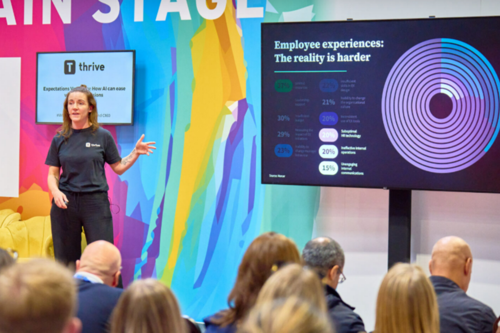 Speaker presenting at the World of Learning Summit 2025 main stage