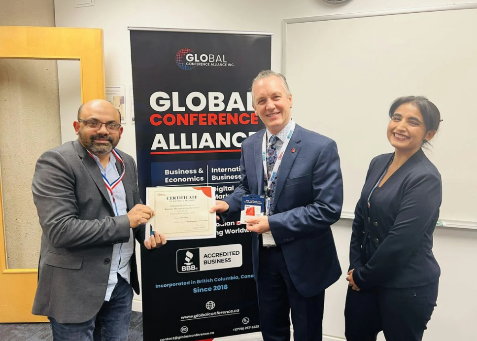 A photo of attendees accepting a certificate for attending the Global Conference on Leadership and Change Management conference