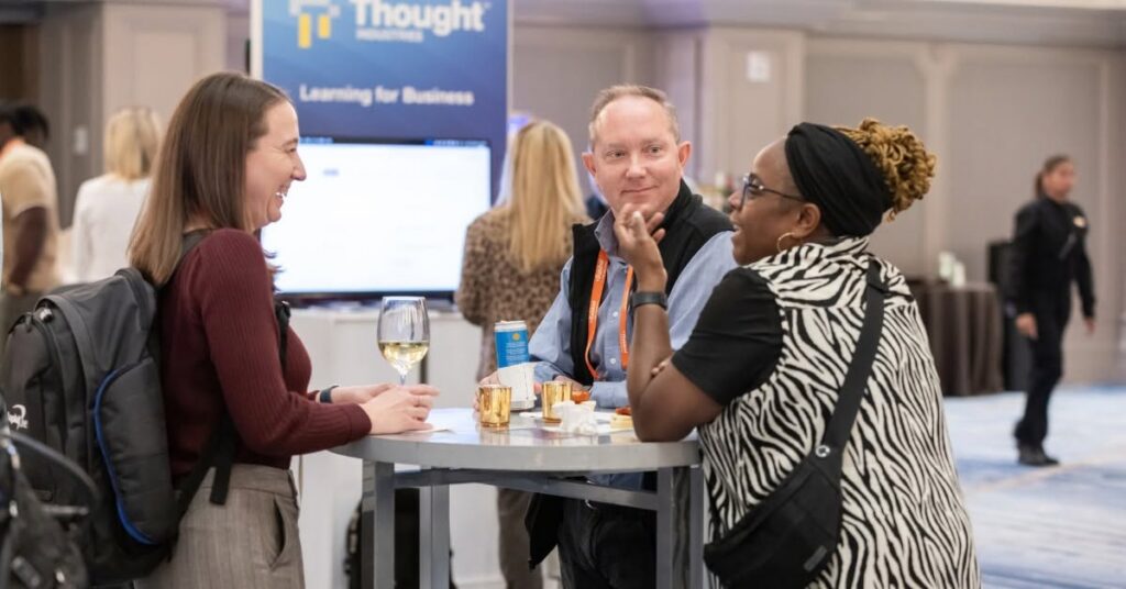 Attendees engaging with each other at the Learning Leadership