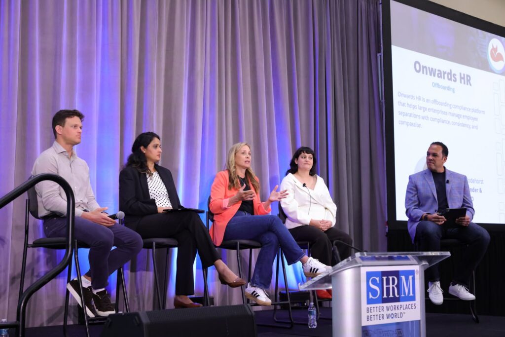 A group of panelists sharing insights on stage during the SHRM Annual Conference