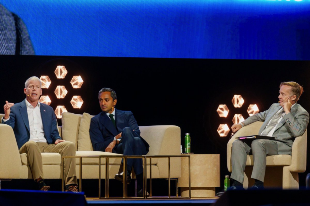 Panel discussion on stage at All-In Summit 2025