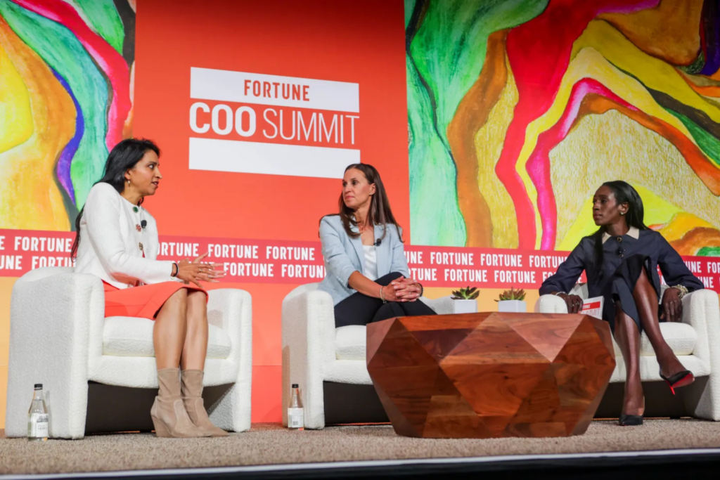 Block COO and CFO Amrita Ahuja, Hasbro CFO and COO Gina Goetter, and Fortune’s Ruth Umoh, shared the stage of Fortune COO Summit 2025