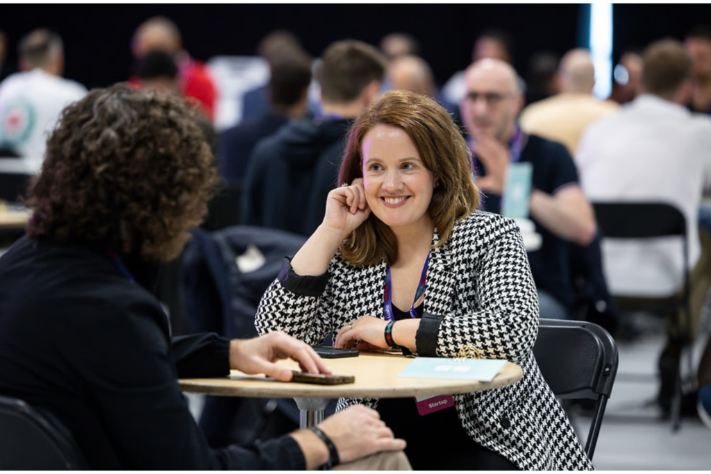 Attendees engaged in a one-on-one discussion at Shift Europe conference