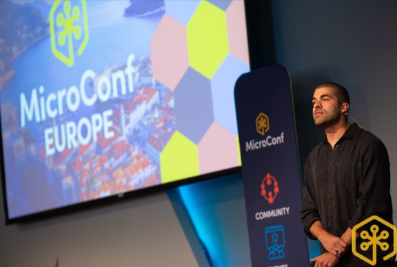 Speaker presenting at the MicroConf Europe conference for founders