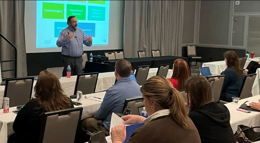 A speaker presenting at the NPELRA Annual Conference