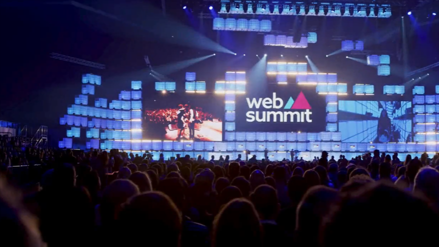 The audience at the Web Summit is engaged in a dynamic conference event