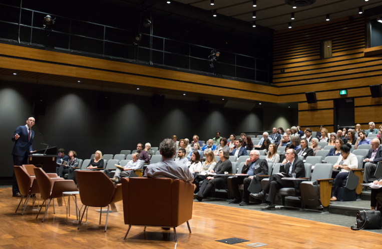A speaker discussing at the CIRA Conference