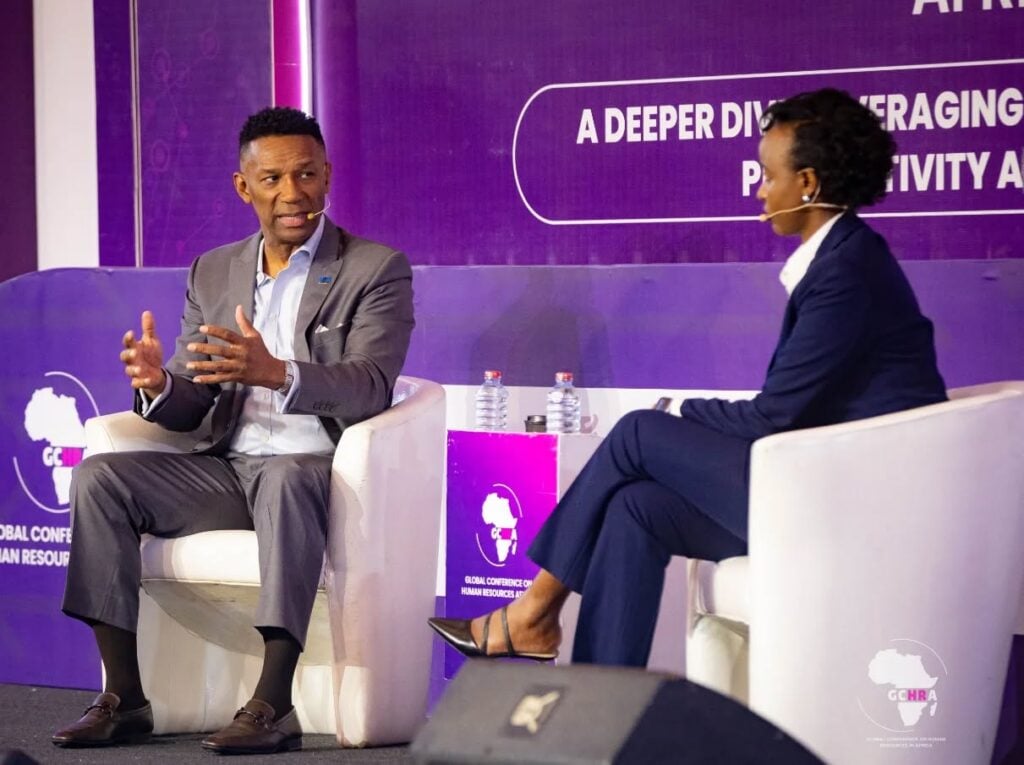 Two speakers onstage during a leadership discussion session at Global Conference on Human Resources in Africa