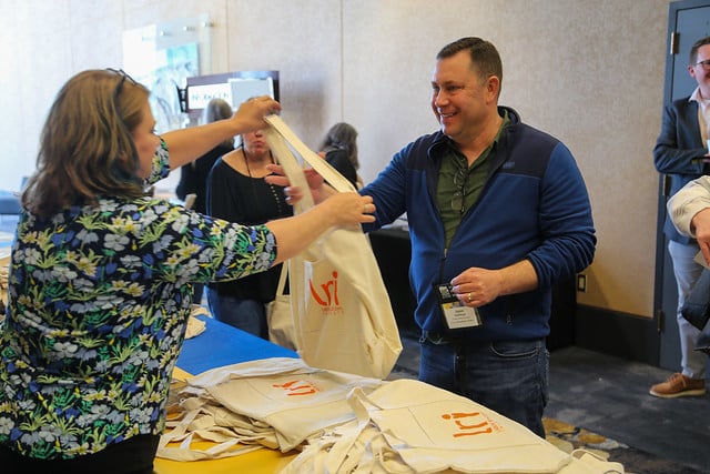 Attendees receiving souvenirs at the Labor Relations Institute conference