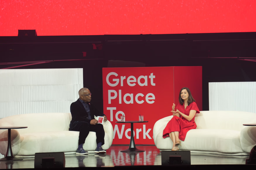 Michael C. Bush, CEO at Great Place to Work, interviewing Hilton's CHRO Laura Fuentes, at the 2025 For All Summit