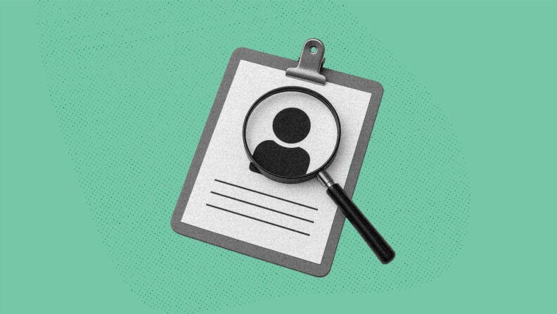 A magnifying glass hovers over a resume with a person icon on it to imply examining someone closely.