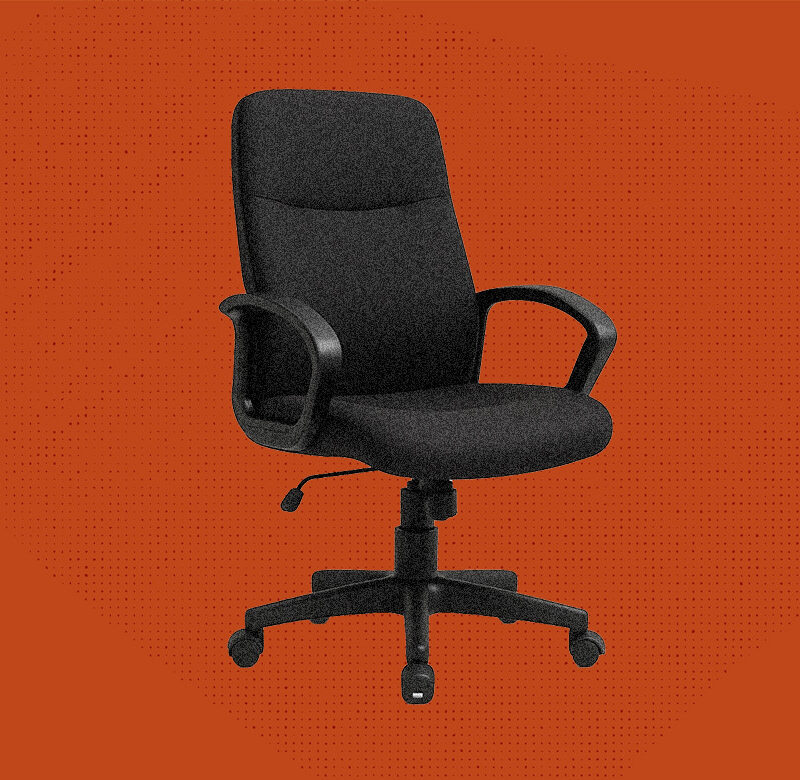 An empty chair in front of a blank red background