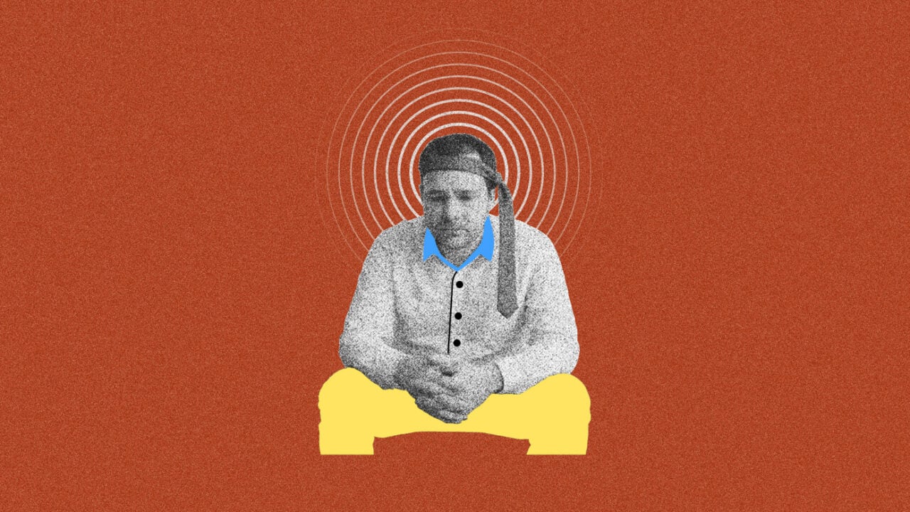 A man looks stressed ponders the impact of a layoff