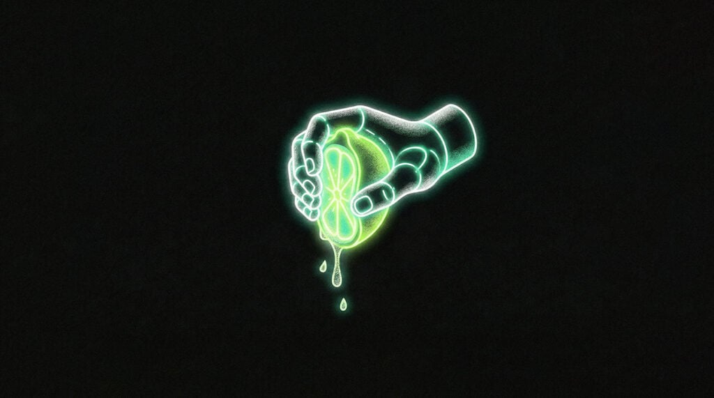 A hand squeezes juice from a piece of fruit to depict the analogy of getting more juice from your AI efforts.